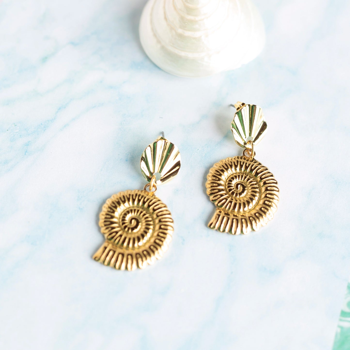 Boucles d'oreilles Nautilus - acier doré