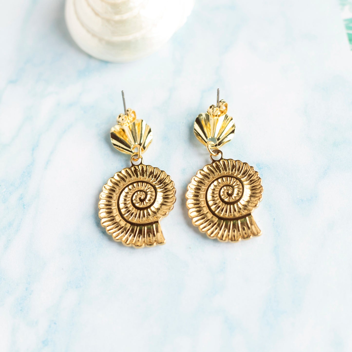 Boucles d'oreilles Nautilus - acier doré