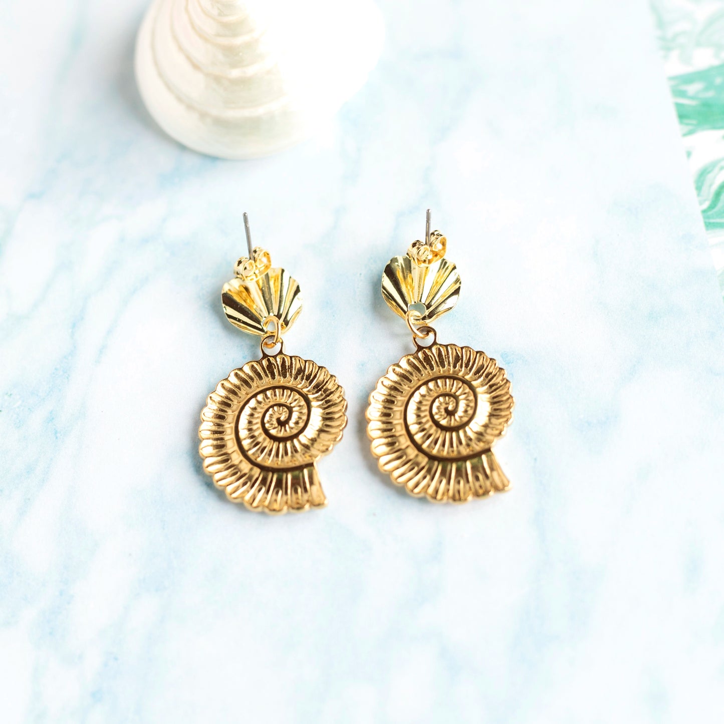 Boucles d'oreilles Nautilus - acier doré