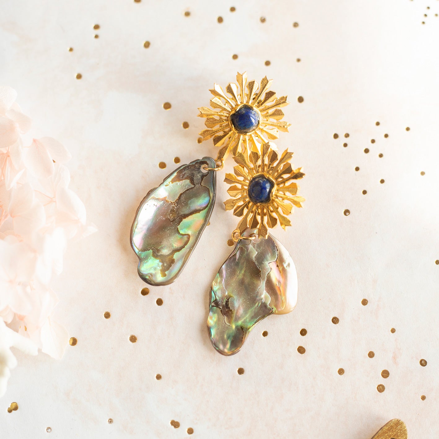 Gold sun and abalone chip earrings