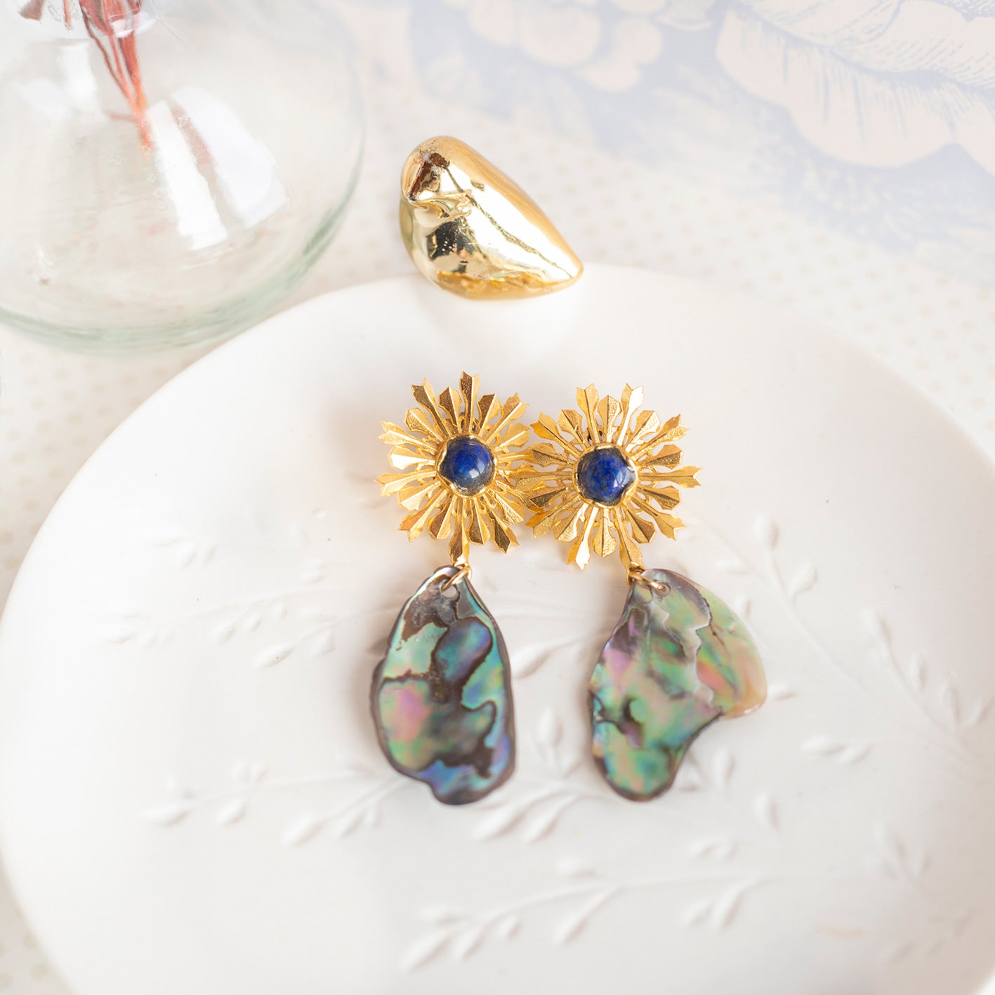 Gold sun and abalone chip earrings