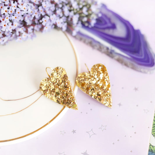 Boucles d'oreilles coeurs dorés à paillettes