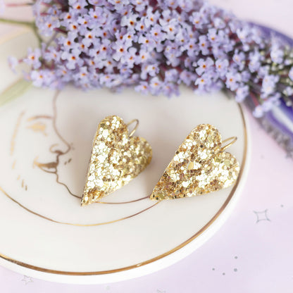 Boucles d'oreilles coeurs dorés à paillettes