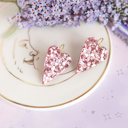 Boucles d'oreilles coeurs roses à paillettes