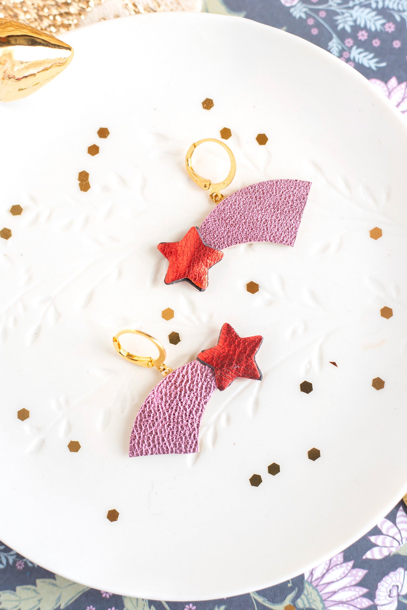 Metallic pink red and gold shooting star earrings