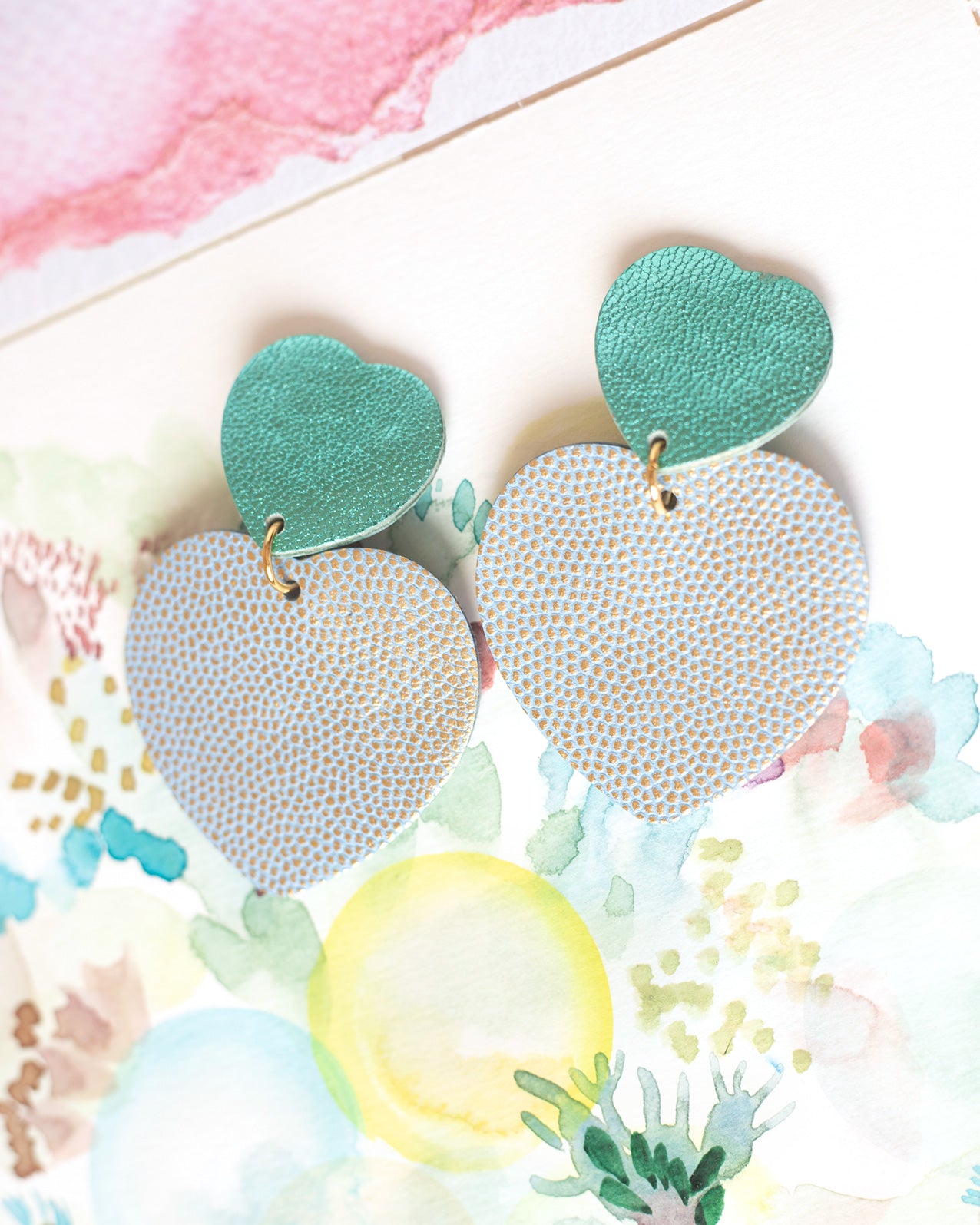 Double Hearts clip-on earrings in turquoise blue leather