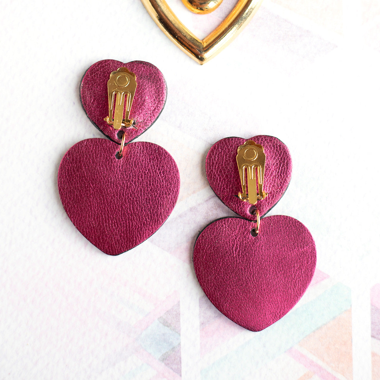 Double Hearts clip-on earrings - metallic raspberry and blue leather