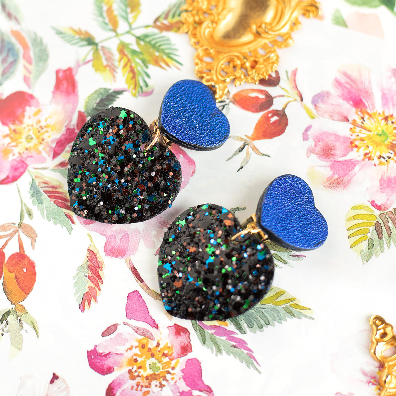 Double Hearts clip-on earrings - metallic blue leather and black sequins