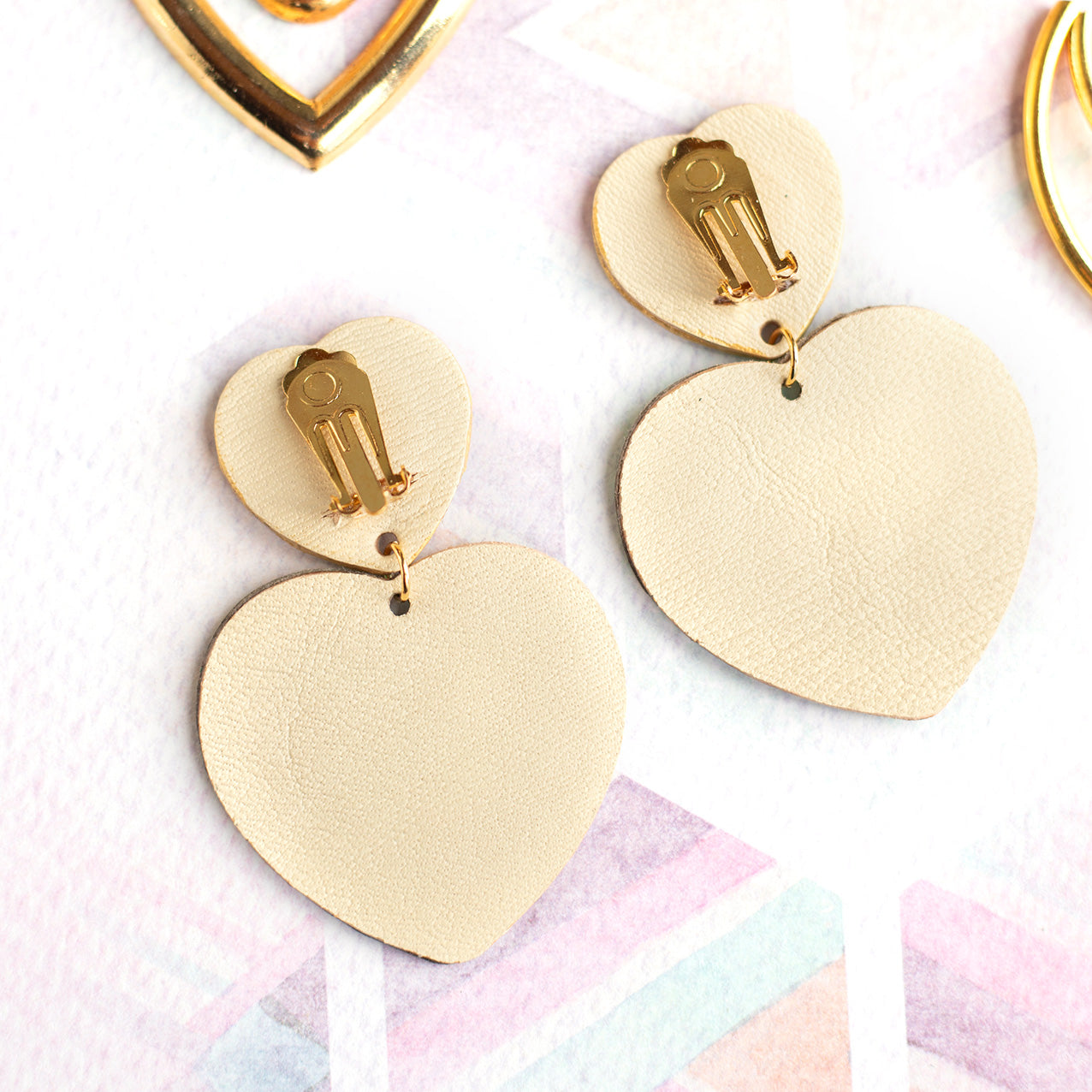 Double Hearts clip-on earrings - holographic and iridescent leather