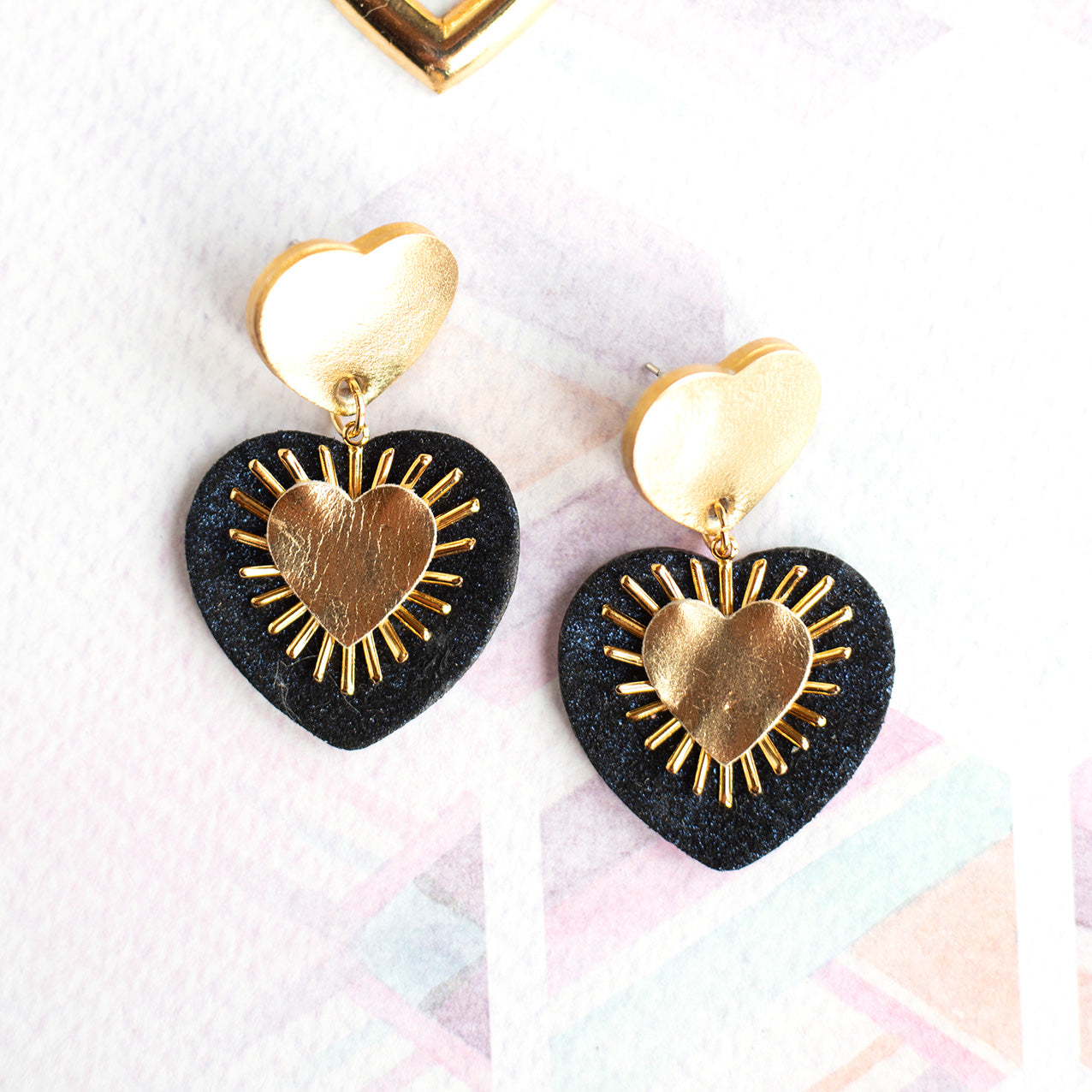 Sacré Coeur gold leather and midnight blue glitter earrings