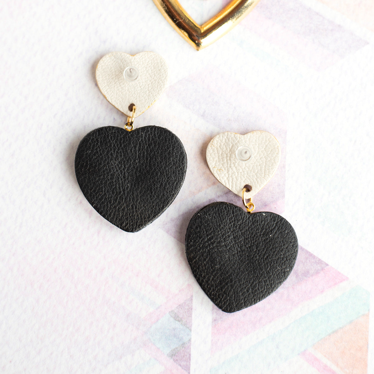 Sacré Coeur gold leather and midnight blue glitter earrings