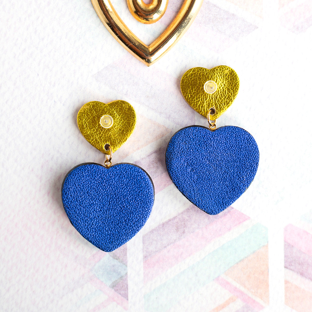 Sacré Coeur earrings in metallic chartreuse and ultramarine blue leather