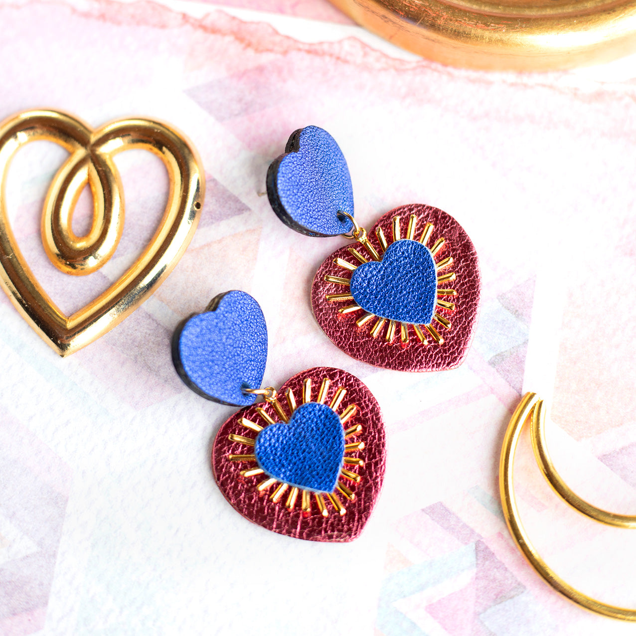 Sacré Coeur earrings in ultramarine blue and metallic raspberry pink leather