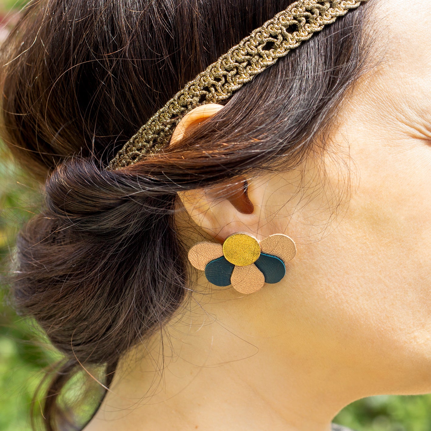 Dark blue-green and gold flower stud earrings