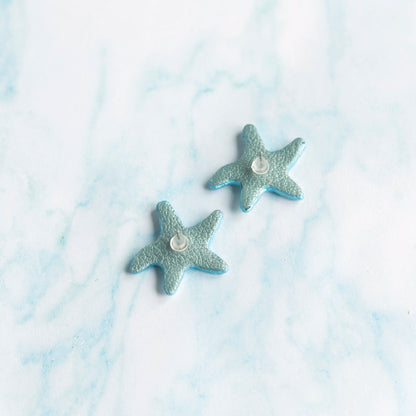 Boucles d'oreilles puces Étoiles de mer cuir blanc holographique