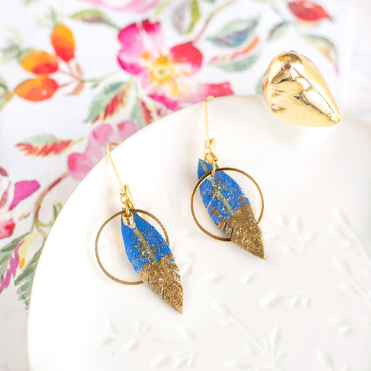 Electric blue leather feather hoop earrings