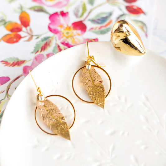 Beige and gold leather feather hoop earrings