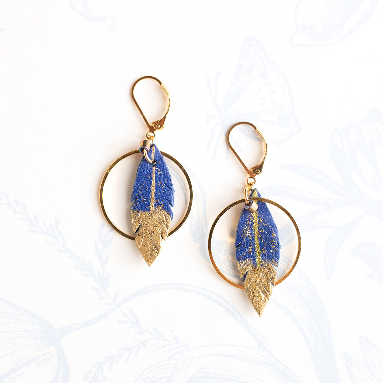 Royal blue leather feather hoop earrings