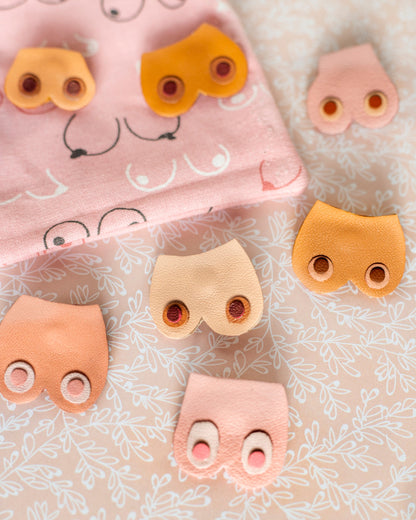 Pin's Nénés rose moyen