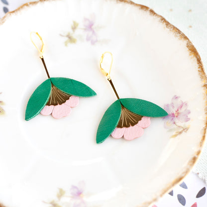 Recycled leather ginkgo flower earrings in green and pink with gold accents.