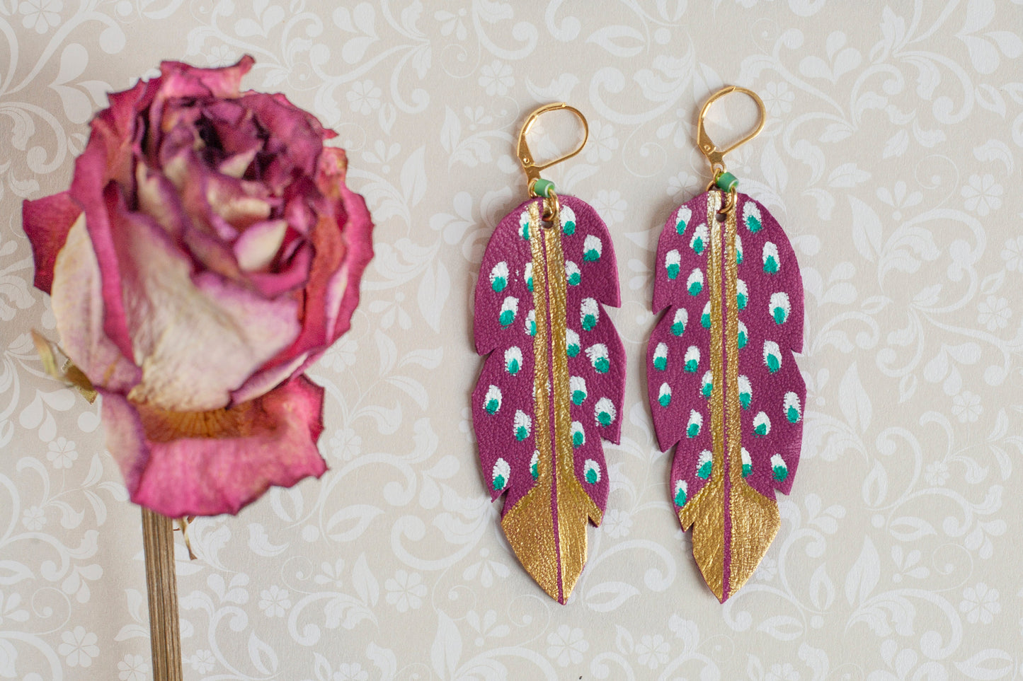 Danaé hand-painted purple leather feather earrings