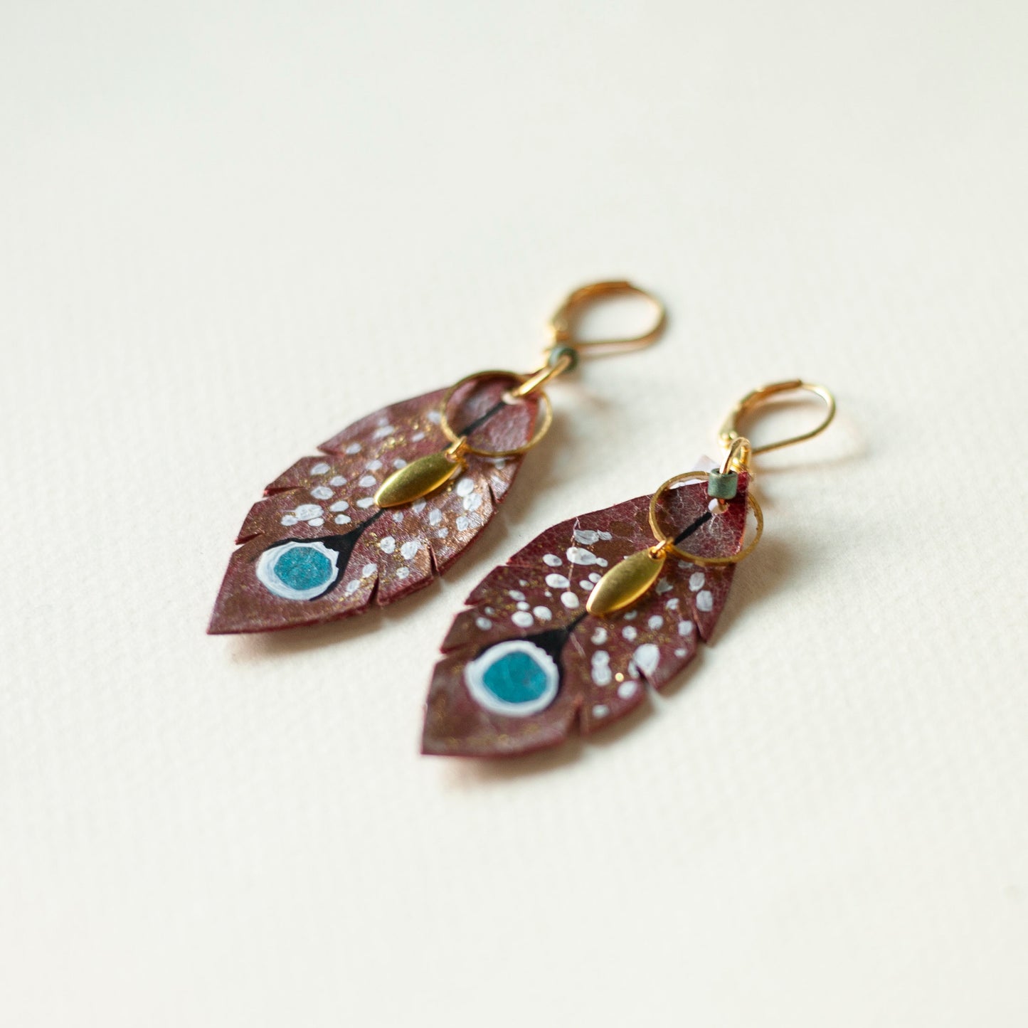 Plume de Paon earrings in brown white blue leather