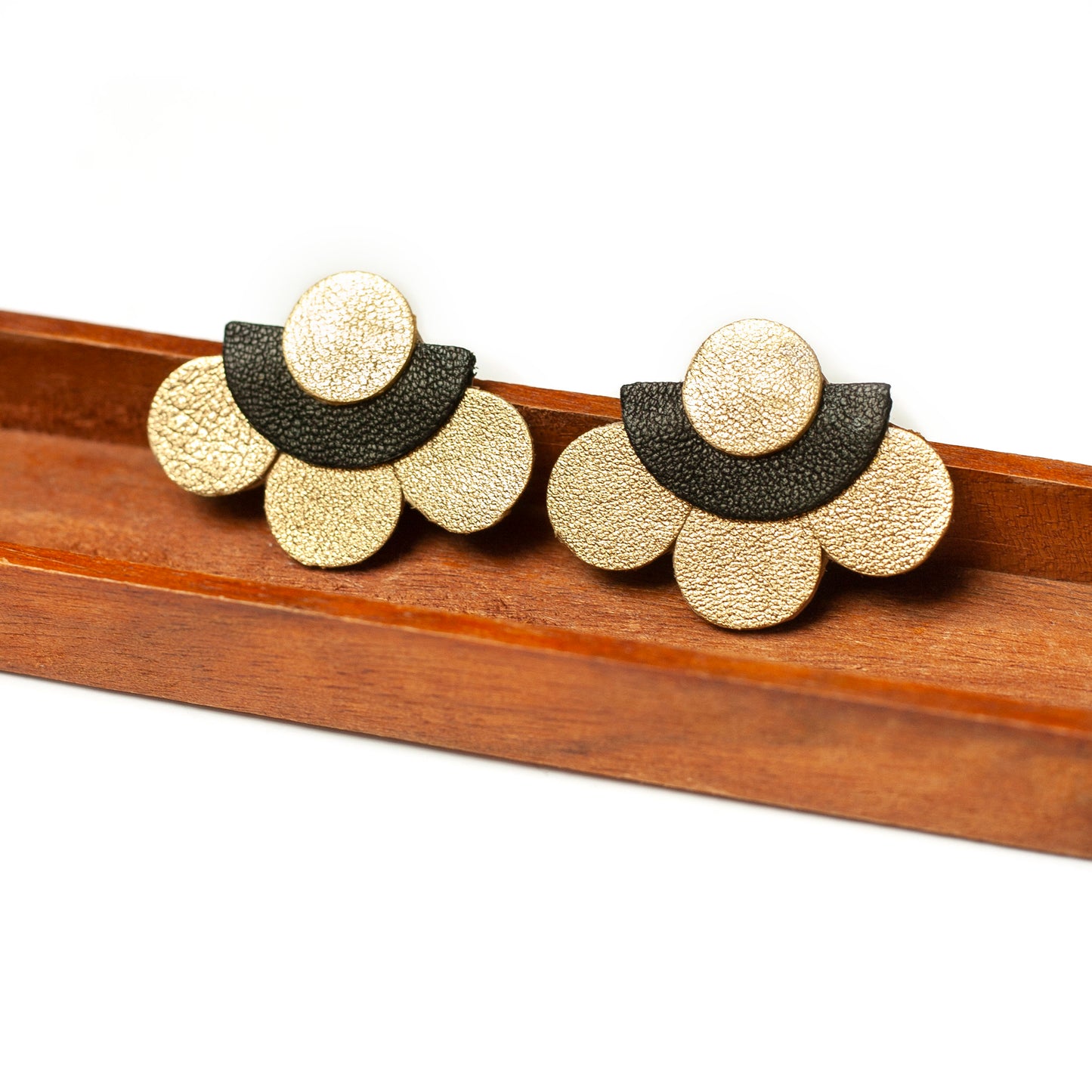 Gold and black leather flower stud earrings