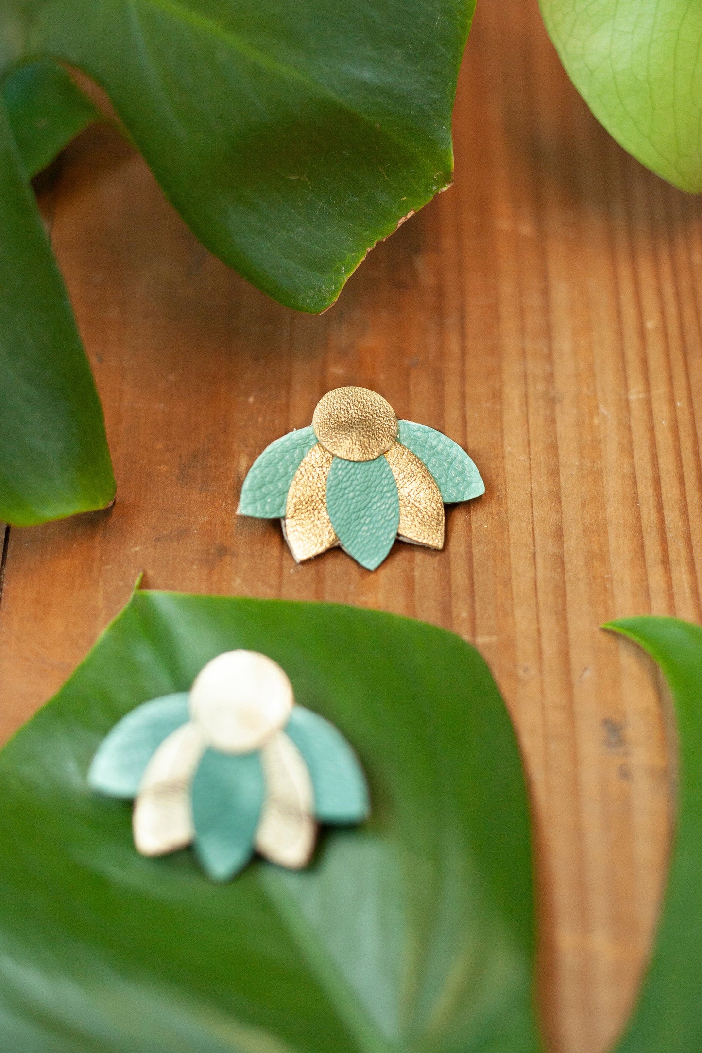 Flower earrings in almond green and gold leather