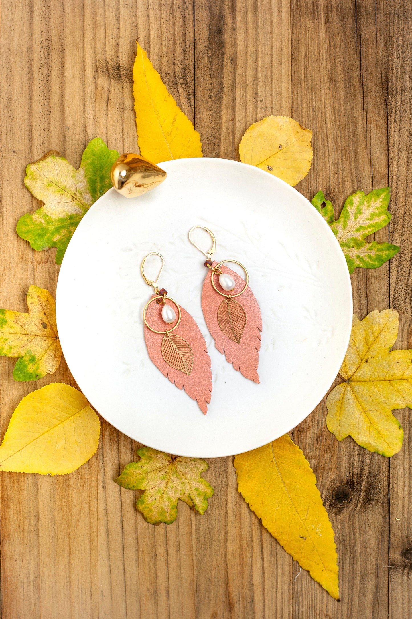 Salmon pink leather feather earrings