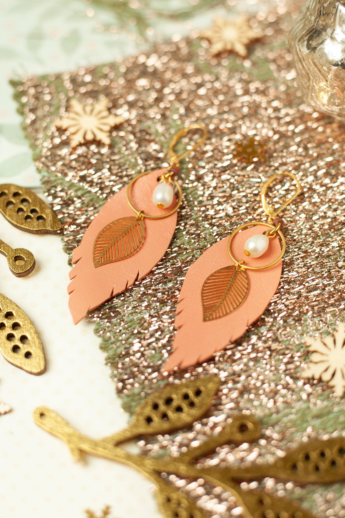 Salmon pink leather feather earrings