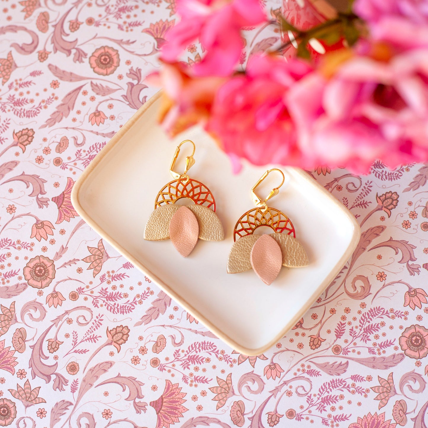 Matte pink and gold leather rosette earrings