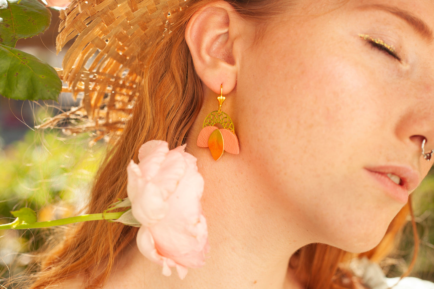 Matte pink and gold leather rosette earrings