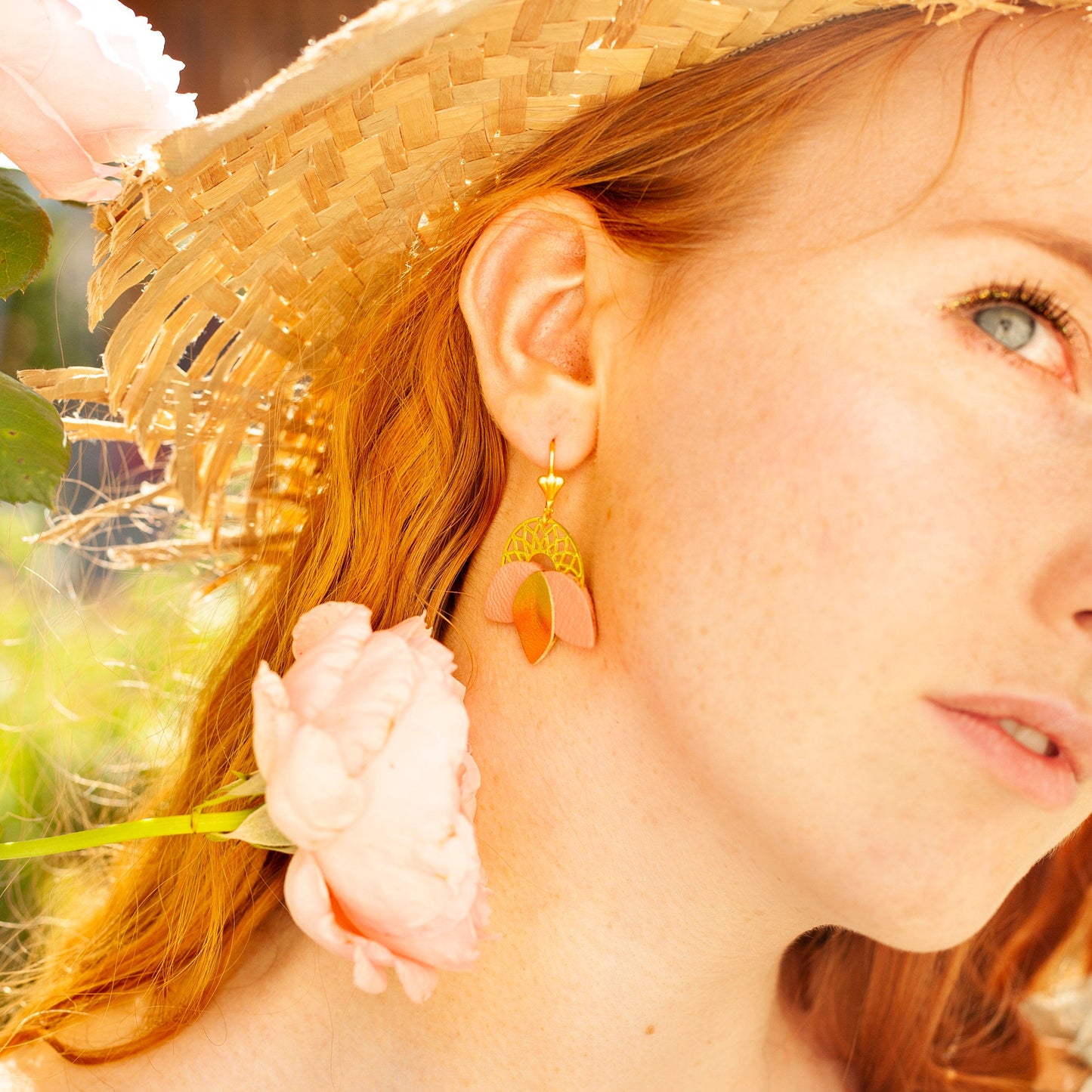 Matte pink and gold leather rosette earrings