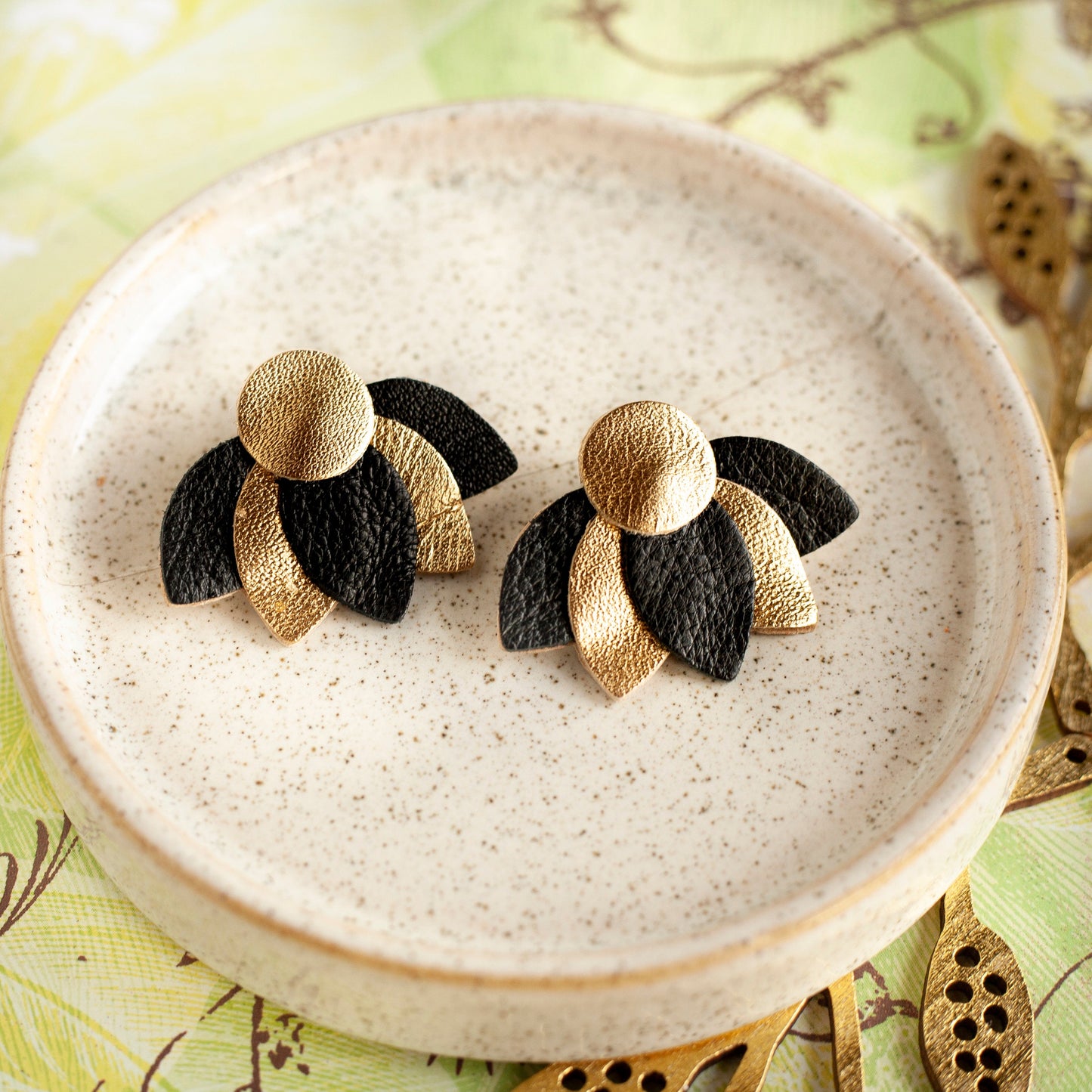 Flower earrings in black and gold leather
