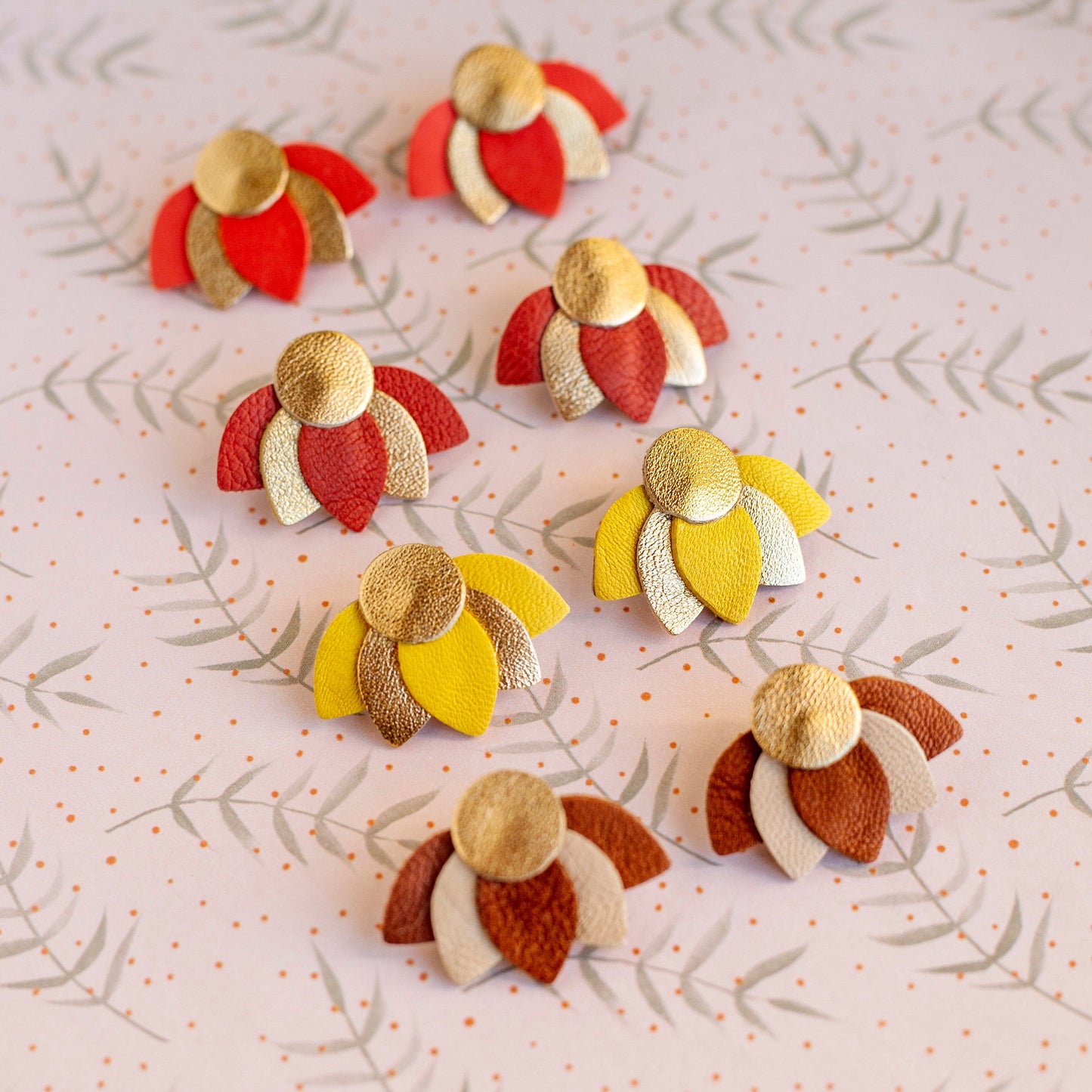 Small lotus flower earrings in orange-red and gold leather